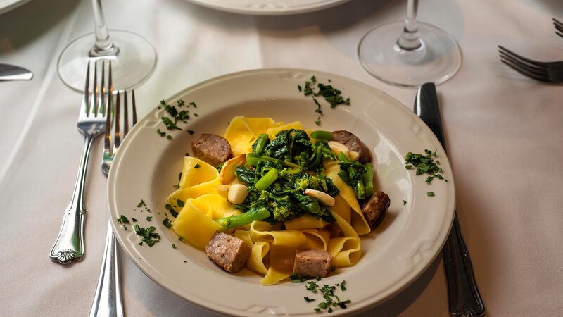 Pasta topped with spinach and spinach